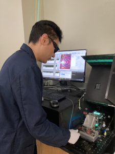 Sixuan Li with the newest generation of the team's device.